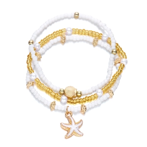Chic multi-layer beaded bracelet set featuring golden starfish and seashell charms