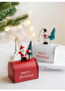 Detailed view of red and white Christmas mailbox ornaments with Santa and Snowman