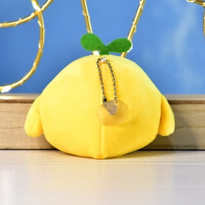 Back view of yellow chick plush keychain with sprout, chain, and suction cup detail.