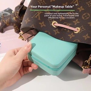 Portable mint green leather jewelry box with zipper closure for travel handbag storage