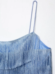 Detail of light blue fringe camisole dress with layered tassels and metallic shimmer