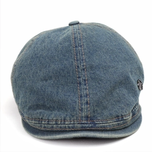 Classic washed blue denim flat cap with vintage faded finish and metal side logo
