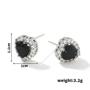 Detail view of heart stud earrings with black stone and cubic zirconia, 1.1cm x 1.0cm