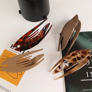 Set of 4 matte and glossy large duckbill hair clips in assorted brown and tortoise colors