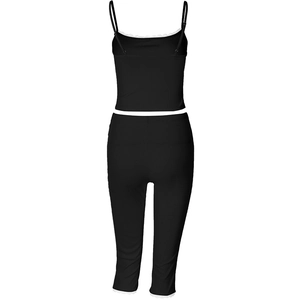 Detail of black ribbed fabric loungewear set featuring delicate lace trim and cami straps