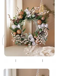 Close-up of a luxury Christmas wreath with pine cones, golden ornaments and silver bow