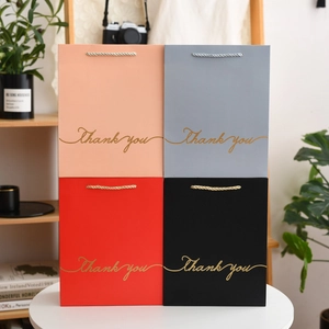 Starry sky gift bags in four colors with gold Thank You text and rope handles