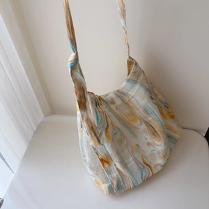 Detail of artistic tree ring pattern on minimalist cotton canvas shoulder bag