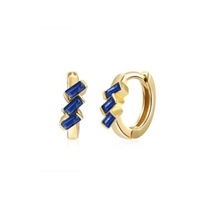 Detail of 18K gold huggie earrings with three baguette-cut deep blue zircon stones