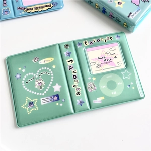 Detail of green star and heart patterned binder with retro MP3 player design features