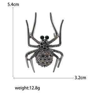 Gothic alloy spider brooch with dark gemstones and green eyes, size 5.4cm by 3.2cm
