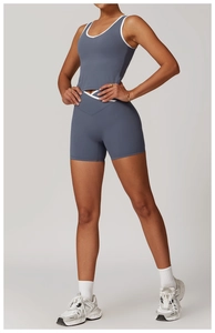 Detail of high-waist criss-cross shorts and racerback top in dusty blue yoga set