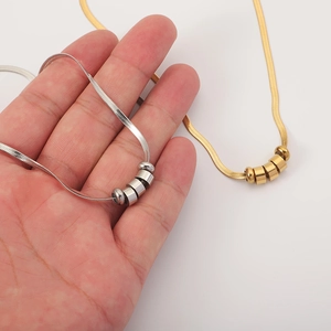 Minimalist snake chain necklace with four small beads in gold and silver finish for women