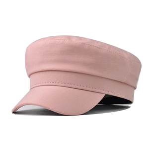 Detail of pink cotton twill newsboy cap showing fine stitching and fabric texture