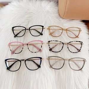 Collection of oversized cat-eye blue light glasses in six trendy colors on white fur