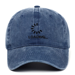 Detail of Loading text embroidery on washed denim blue vintage baseball cap fabric