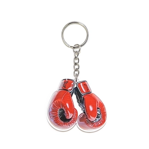 Creative red boxing glove acrylic keychain pendant for men with metal ring on white background