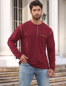 Outdoor shot of men's burgundy long sleeve Henley shirt with chest pocket and stitching