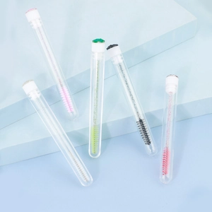 Detailed set of disposable eyelash brushes in crystal tubes with glitter handles and caps
