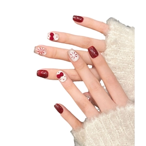 Handgefertigte Kunstnägel mit burgunderrotem Glitzer und 3D-Samtschleifen im Winterstil