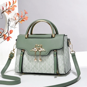 Chic Morandi green crossbody bag with gold swan buckle and monogram canvas finish