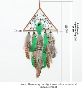 Detail of bohemian dream catcher with green feathers and triangle wood frame size specs