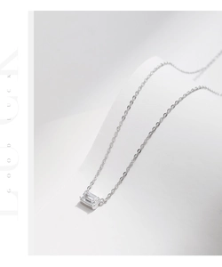 Detailed view of s925 silver necklace with square cubic zirconia and good luck text
