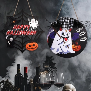Detail of wooden Halloween door signs featuring spider web patterns and Boo letters