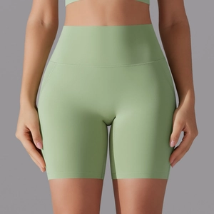 Detail of high-waist seamless yoga shorts in sage green with smooth compression fabric