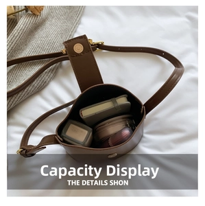Brown leather bucket bag interior showcasing capacity for makeup and notebook items