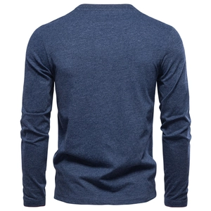 Detail view of the back of a navy blue long-sleeved V-neck t-shirt with soft cotton texture