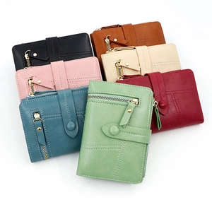 Detailed collection of seven colorful PU leather tri-fold wallets with secure buckle closures