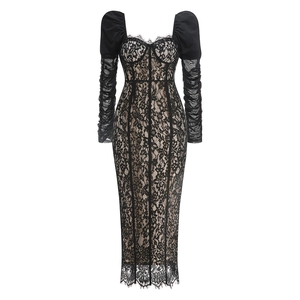 Close-up of black floral lace fabric with hollow-out details and puff sleeves