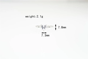 Detail view of heart-shaped moissanite ring showing 7.8mm height and 7.3mm width specs