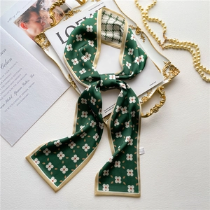 Elegant green floral twilly silk scarf with geometric flower pattern and champagne border
