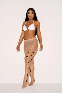 Detail of sheer tights featuring black playing card suits print for artistic leg wear
