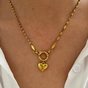 French style gold titanium heart pendant necklace with twisted rope chain on model