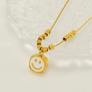 Chic gold titanium steel necklace with smile face pendant and hexagonal beads detail