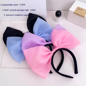 Oversized organza bow headbands in pastel black, blue, purple, and pink macaron colors