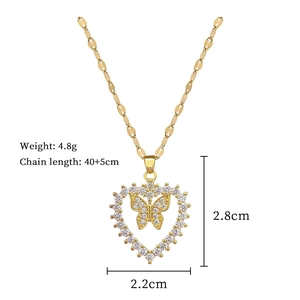 Detailed view of gold butterfly heart necklace with dimensions 2.8cm x 2.2cm and 4.8g weight