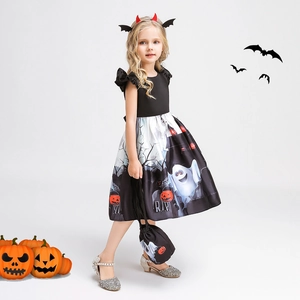 Detail of girls' Halloween pumpkin dress featuring spooky ghosts and R.I.P pattern