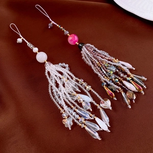 Close-up of crystal agate beaded phone straps with tassel design and faceted glass beads