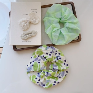Floral print scrunchies and bow hair clips set in elegant French aesthetic style