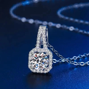 Halo design round moissanite pendant necklace with micro-pave setting on blue background