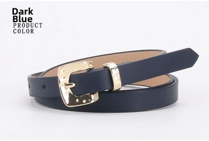 Close-up of navy blue skinny belt featuring textured litchi pattern and gold square buckle