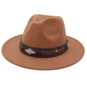 Detail of camel wool fedora with brown leather band and vintage silver metal ornaments