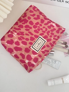 Pink leopard print cosmetic bag with metal zipper and Pleasant Time woven label