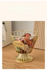 Macro detail of golden metal coffee capsule basket with decorative COFFEE nameplate