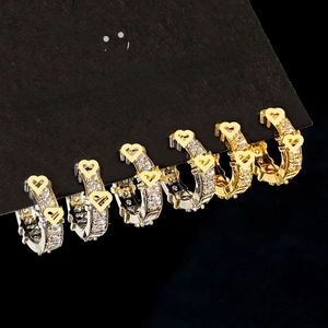 Elegant gold and silver plated C-shaped hoop earrings with sparkling heart-shaped zircons