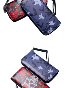 Detail of gothic long wallets featuring embossed ghost, bat, and skull floral patterns